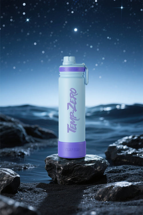 TempZero water bottle on a rock with a starry night sky background